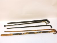 Lot 615 - A Rhino horn? mounted walking stick