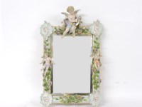 Lot 653 - A Meissen style wall mirror