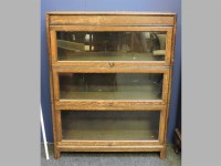 Lot 874 - A three section Globe Wernicke stacking bookcase