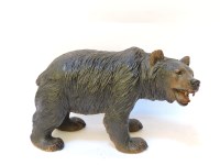 Lot 471 - A carved and stained pine black forest bear