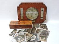 Lot 198 - A mahogany inlaid barometer