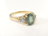 Lot 218 - An 18ct gold oval cut chrysobery and diamond ring