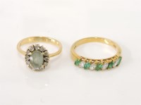 Lot 233 - An 18ct gold aquamarine and diamond cluster ring