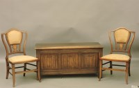 Lot 854 - A reproduction panelled oak coffer