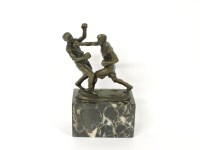 Lot 1199 - A bronze sculpture of two boxers