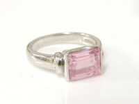 Lot 1015 - A 9ct white gold baguette cut pink cubic zirconia ring