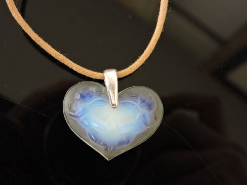 Lot 1024 - A Lalique opalescent glass heart shaped pendant