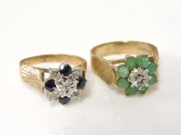 Lot 1019 - A 9ct gold diamond and emerald cluster ring