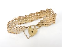 Lot 1034 - A 9ct gold five row gate link bracelet
