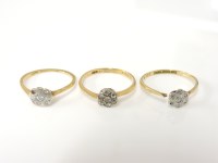 Lot 1043 - Three 18ct gold diamond daisy cluster rings