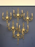 Lot 1386 - A set of six gilt metal wall lights