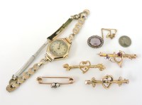 Lot 1054 - A gold diamond and seed pearl bar brooch