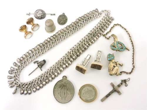 Lot 1056 - An Indian silver gilt snake charmer brooch