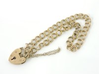 Lot 1032 - A 9ct gold double curb link chain with padlock