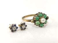 Lot 1027 - A pair of gold diamond and sapphire cluster earrings