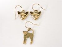 Lot 1011 - A pair of 9ct gold cat head earrings