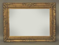 Lot 1504 - A reproduction gilt mirror