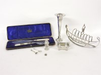 Lot 1083 - A silver plated toast rack in the form of a boat