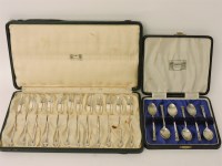 Lot 1074 - A set of twelve silver cake forks