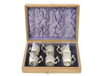 Lot 1134 - A set of six silver mounted liqueur cups