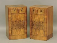 Lot 851 - A pair of Art Deco walnut bow front bedside cupboards