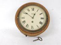 Lot 647 - An oak wall clock