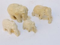 Lot 1100 - A late 19th century family of four carved ivory elephants