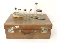 Lot 1232 - A suitcase fitted with dressing table items