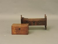 Lot 1423 - A late 19th century French walnut miniature crib