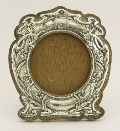 Lot 100 - An Edwardian silver-mounted wooden photograph frame