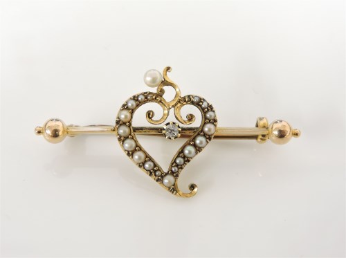 Lot 48 - A gold diamond and split pearl witch's heart bar brooch