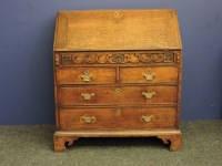 Lot 820 - An 18th century oak bureau