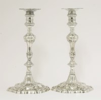 Lot 145 - A matched pair of George III large silver candlesticks