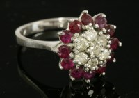 Lot 470 - A white gold diamond and ruby cluster ring