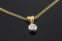 Lot 574 - An 18ct gold single stone diamond pendant