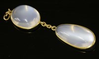 Lot 428 - An Edwardian two-stone moonstone gold pendant