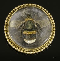 Lot 362 - A Victorian reverse painted crystal intaglio gold brooch