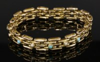 Lot 406 - An Edwardian turquoise and split pearl set expanding gold gate bracelet