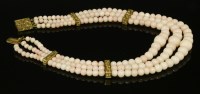 Lot 403 - A Victorian three-row graduated coral bead necklace