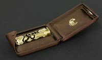 Lot 474 - A gold and enamel lighter