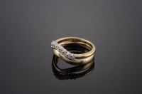 Lot 500 - An 18ct gold diamond set half hoop ring