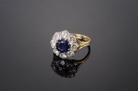 Lot 547 - An 18ct gold sapphire and diamond circular cluster ring