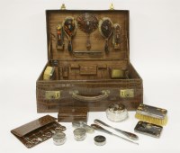 Lot 169 - A Victorian and later silver-mounted tortoiseshell travelling set