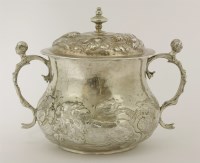 Lot 63 - A Charles II silver two-handled porringer and cover