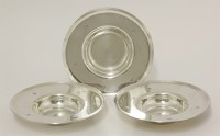 Lot 211 - A set of three silver dishes 
by Gerald Benney