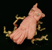 Lot 465 - A carved coral and diamond set novelty owl brooch pendant