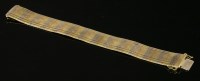 Lot 477 - An Italian three-colour gold Milanese bracelet