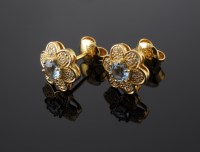 Lot 579 - A pair of aquamarine and diamond daisy cluster stud earrings