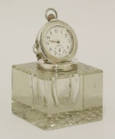 Lot 224 - An Edwardian novelty silver-mounted glass desk clock inkwell