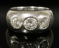 Lot 565 - An 18ct gold three-stone diamond gypsy ring